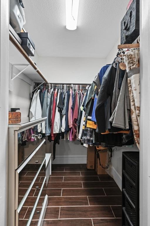 spacious closet featuring heating unit