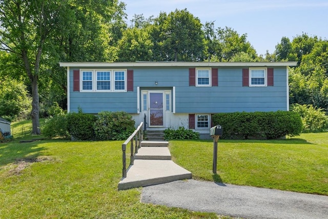 16 Winding Ln, Lowell, MA 01852 - bi-level home featuring a front lawn