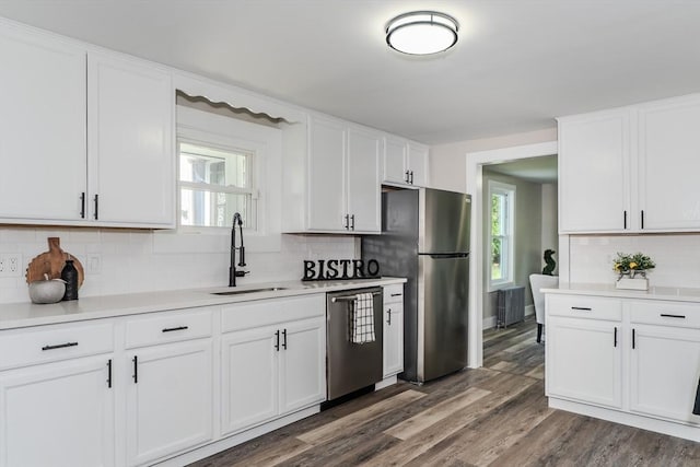 7 2nd Ave, Ware, MA 01082 - kitchen featuring appliances with stainless steel finishes, backsplash, light countertops, and white cabinets