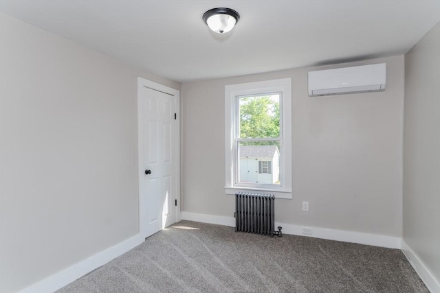 7 2nd Ave, Ware, MA 01082 - spare room with radiator, a wall mounted AC, and carpet floors