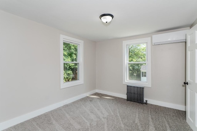 7 2nd Ave, Ware, MA 01082 - unfurnished room featuring radiator, a wall mounted AC, healthy amount of natural light, and carpet flooring