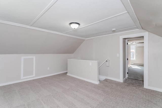 7 2nd Ave, Ware, MA 01082 - additional living space with lofted ceiling, carpet flooring, a baseboard heating unit, and a wall unit AC
