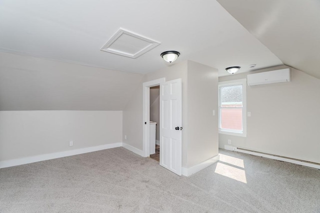 7 2nd Ave, Ware, MA 01082 - additional living space featuring a baseboard radiator, a wall mounted air conditioner, vaulted ceiling, attic access, and carpet