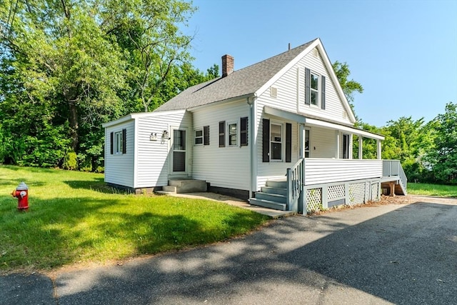 7 2nd Ave, Ware, MA 01082 - bungalow with a chimney, a front lawn, roof with shingles, and covered porch