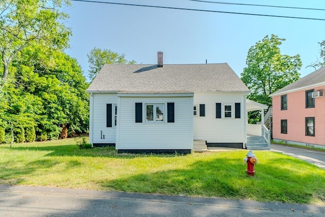 7 2nd Ave, Ware, MA 01082 - bungalow with a chimney, a front lawn, and roof with shingles