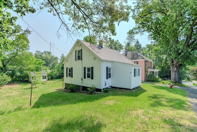 7 2nd Ave, Ware, MA 01082 - back of house with a lawn, a chimney, and roof with shingles