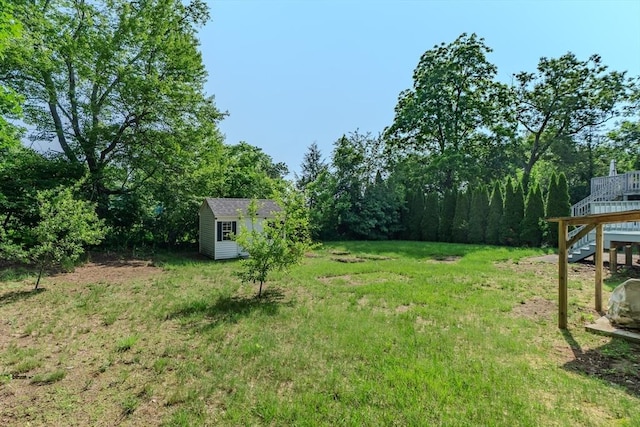 7 2nd Ave, Ware, MA 01082 - view of yard with a storage unit, stairs, and a wooden deck