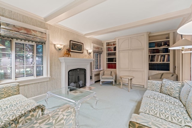 living room with built in features, beam ceiling, and light colored carpet