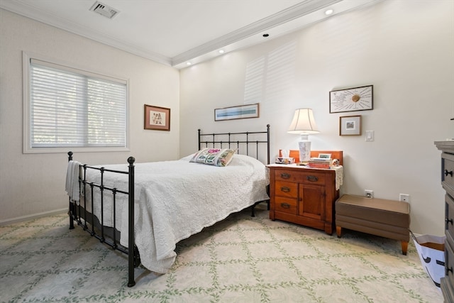 bedroom featuring crown molding and light carpet