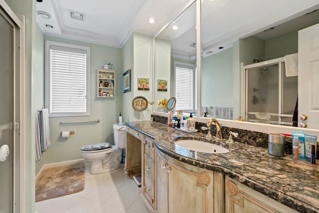 bathroom with vanity, toilet, a wealth of natural light, and walk in shower