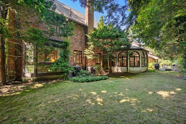 view of yard featuring a sunroom