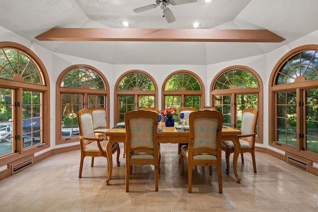 dining space featuring a wealth of natural light, ceiling fan, and vaulted ceiling with beams