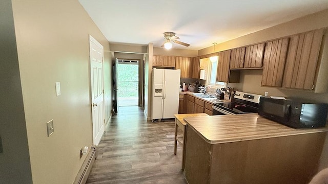 1755 Maple St, Dighton, MA 02764 - kitchen with white fridge with ice dispenser, stainless steel electric range oven, black microwave, brown cabinetry, and wood finished floors