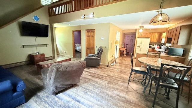 1755 Maple St, Dighton, MA 02764 - living area with baseboard heating and light wood-type flooring