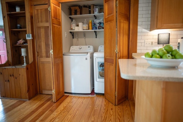 11 Cliff St, Dennis, MA 02638 - clothes washing area with washer and dryer and light wood-style flooring