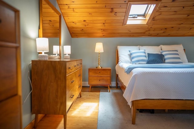 11 Cliff St, Dennis, MA 02638 - bedroom featuring a skylight, lofted ceiling, and light wood-style flooring