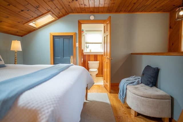 11 Cliff St, Dennis, MA 02638 - bedroom with a skylight, wooden ceiling, wood finished floors, vaulted ceiling, and ensuite bathroom