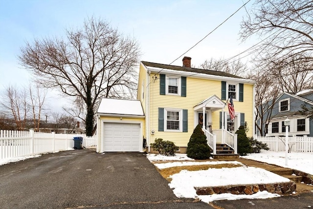 colonial home with a garage