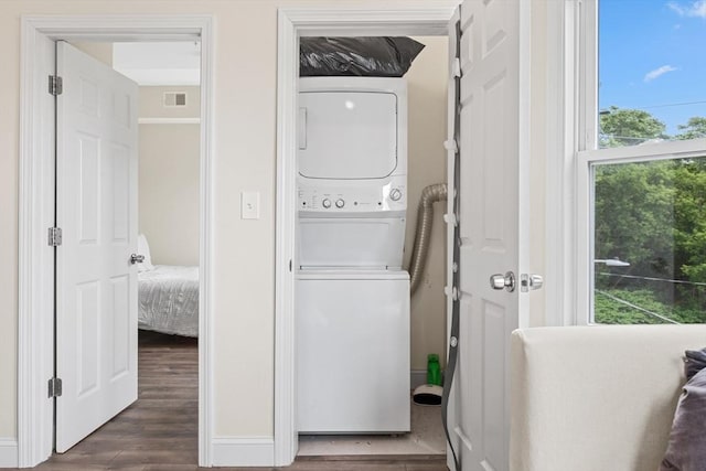 10 Elliott Pl Unit 3F, Peabody, MA 01960 - washroom with stacked washer / dryer and dark wood-style floors