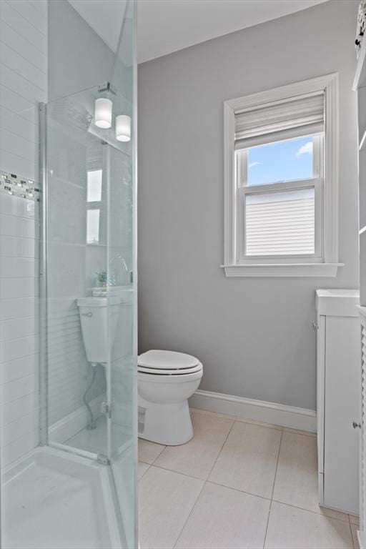 10 Elliott Pl Unit 3F, Peabody, MA 01960 - bathroom featuring tile patterned flooring, a tile shower, and vanity