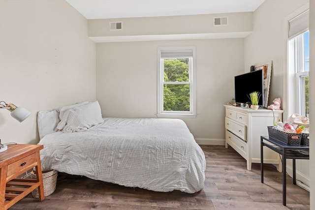 10 Elliott Pl Unit 3F, Peabody, MA 01960 - bedroom featuring multiple windows and light wood-type flooring