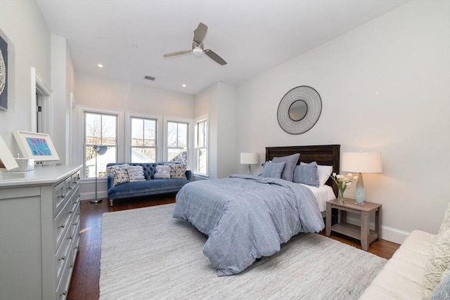 bedroom with ceiling fan, recessed lighting, dark wood-type flooring, visible vents, and baseboards