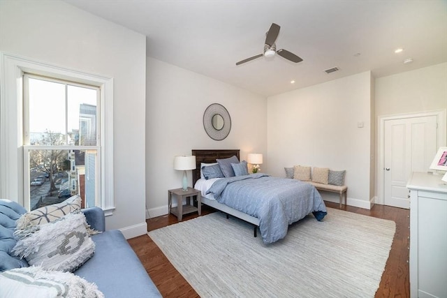 bedroom featuring recessed lighting, dark wood finished floors, and baseboards