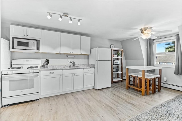 kitchen with a sink, light stone countertops, white appliances, and white cabinetry