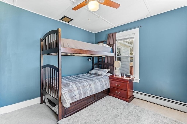 bedroom with baseboards, a ceiling fan, a baseboard heating unit, and carpet flooring
