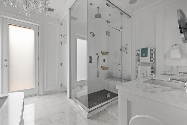 68 W Rutland Sq, Boston, MA 02118 - full bathroom featuring a stall shower, marble look tile flooring, a towel warmer, vanity, and a chandelier