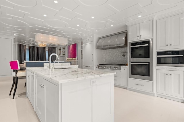 68 W Rutland Sq, Boston, MA 02118 - kitchen featuring stainless steel appliances, extractor fan, a sink, a kitchen island with sink, and white cabinets