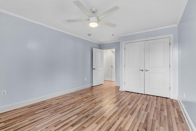 unfurnished bedroom with ceiling fan, a closet, crown molding, and light hardwood / wood-style floors