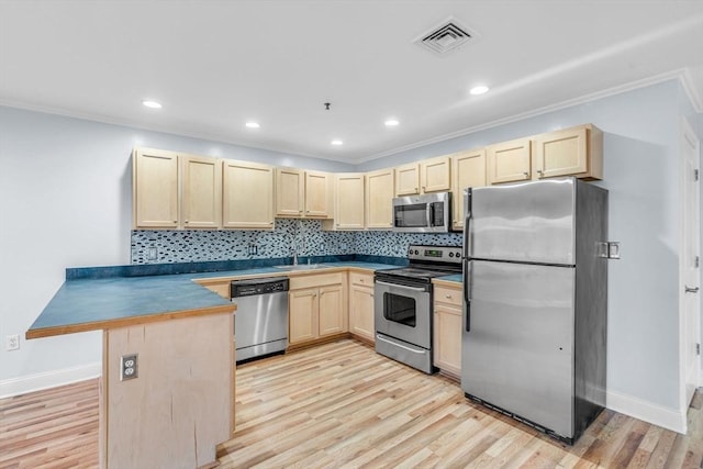 kitchen with kitchen peninsula, backsplash, stainless steel appliances, and light hardwood / wood-style flooring