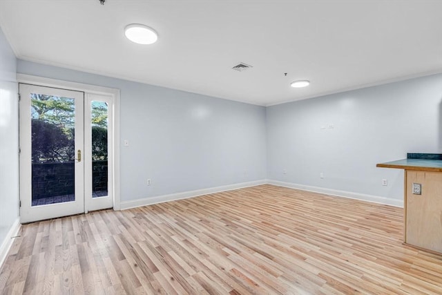 unfurnished living room with light hardwood / wood-style floors