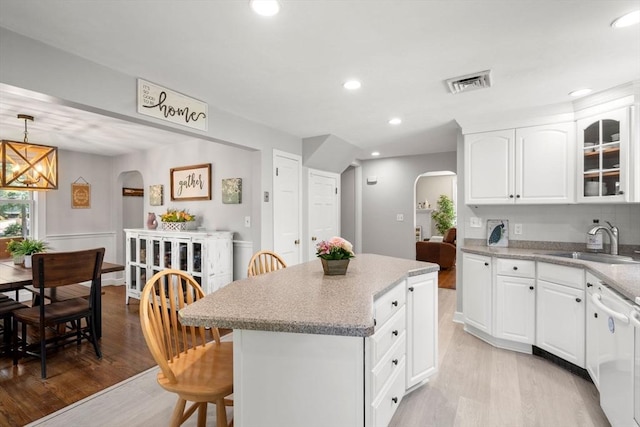 150 Academy St, Braintree, MA 02184 - kitchen with arched walkways, a sink, light wood-type flooring, dishwasher, and recessed lighting