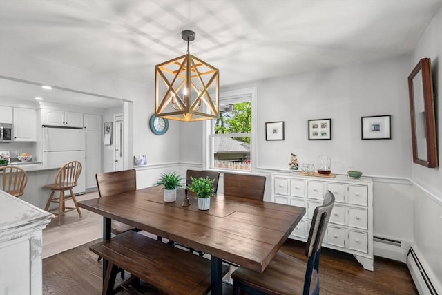 150 Academy St, Braintree, MA 02184 - dining room featuring dark wood-style flooring, a baseboard heating unit, and a chandelier