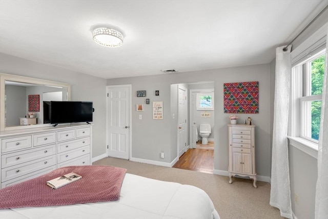 150 Academy St, Braintree, MA 02184 - bedroom with multiple windows, baseboards, light colored carpet, and ensuite bathroom