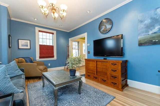 living room featuring a chandelier, crown molding, and wood-type flooring