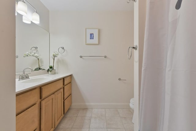 bathroom featuring toilet, baseboards, a shower with shower curtain, tile patterned flooring, and vanity