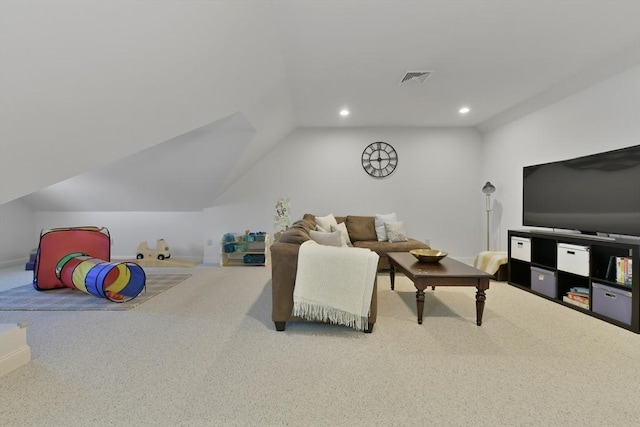 carpeted living area with vaulted ceiling, visible vents, and recessed lighting