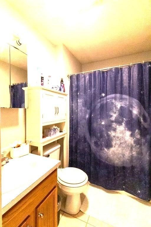 167 Orient St, Worcester, MA 01604 - bathroom featuring vanity, tile patterned floors, and curtained shower