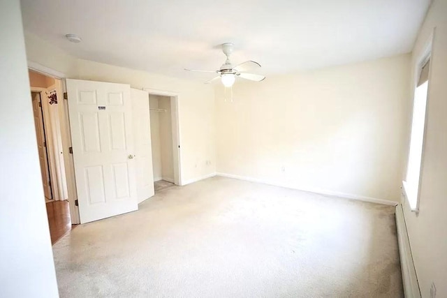 167 Orient St, Worcester, MA 01604 - unfurnished bedroom featuring light carpet, ceiling fan, and a closet