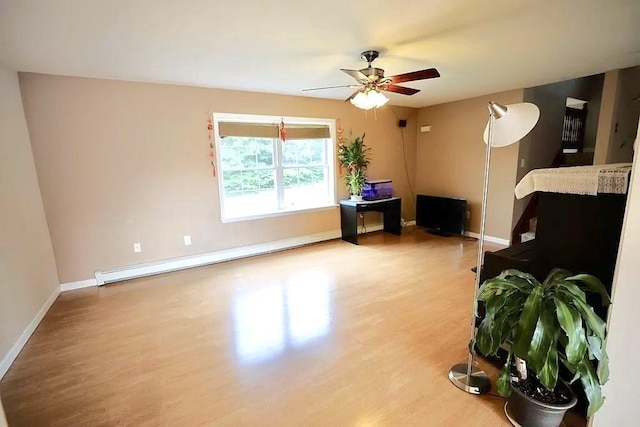 167 Orient St, Worcester, MA 01604 - living area with a baseboard heating unit, wood finished floors, and ceiling fan