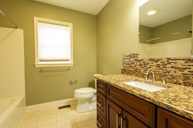 bathroom featuring toilet, tile patterned flooring, visible vents, and backsplash