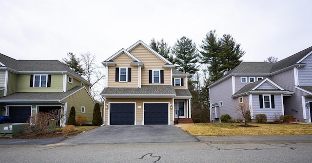 traditional home featuring an attached garage and driveway