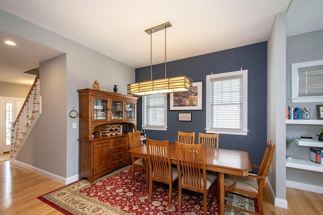 82 Snowbird Ave, Weymouth, MA 02190 - dining space with stairway and light wood-type flooring