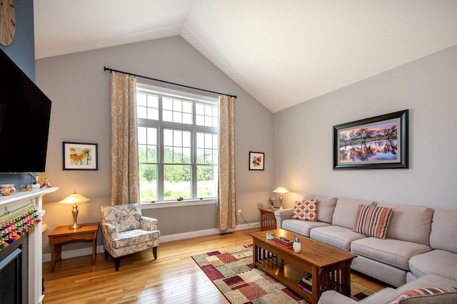 82 Snowbird Ave, Weymouth, MA 02190 - living area with vaulted ceiling and light wood-type flooring