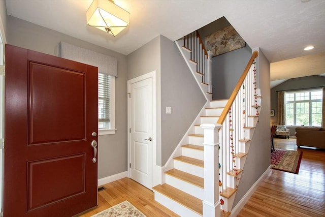 82 Snowbird Ave, Weymouth, MA 02190 - entryway with light wood-style floors and stairs