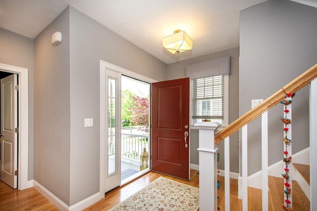 82 Snowbird Ave, Weymouth, MA 02190 - foyer entrance featuring wood finished floors and stairway