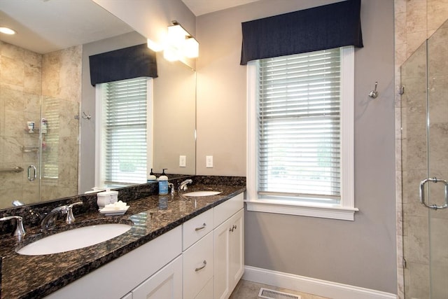82 Snowbird Ave, Weymouth, MA 02190 - full bathroom with a stall shower, double vanity, and plenty of natural light